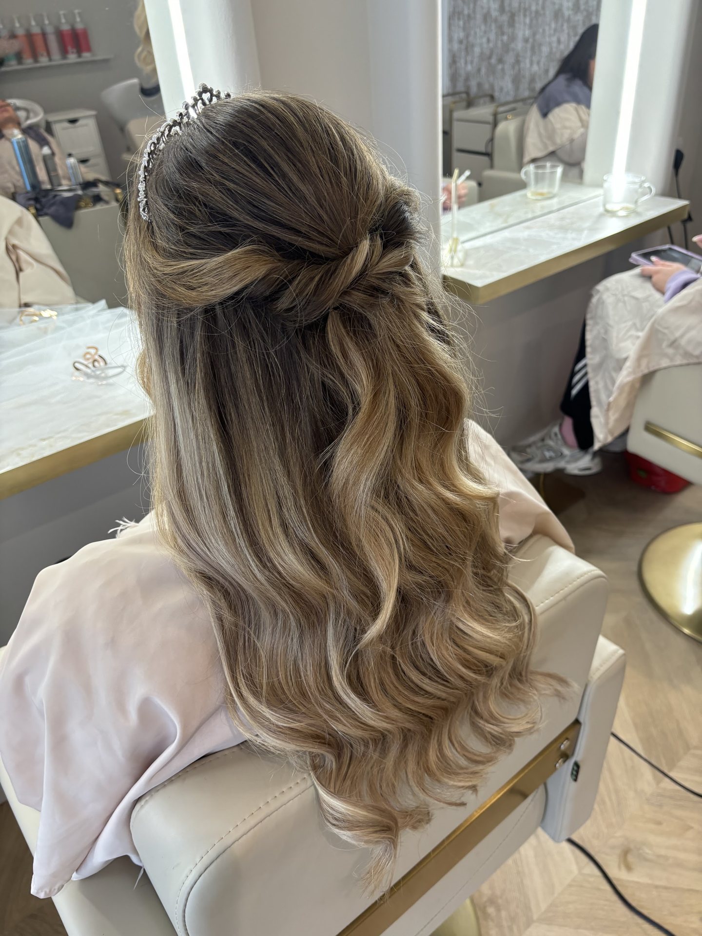 Half-up bridal hairstyle with long flowing curls