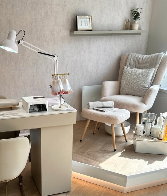 Lauren's nail station with polish display and a comfortable pedicure chair
